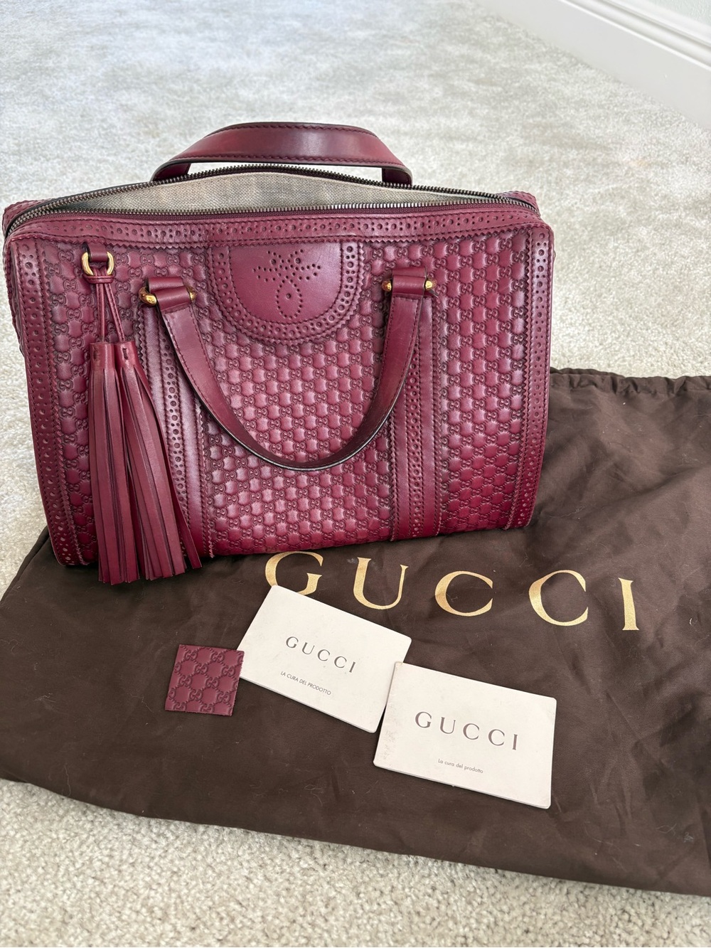 Gucci Burgundy Leather Tassel Satchel with Embossed Monogram